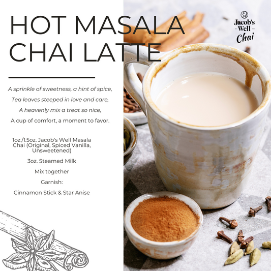 Hot Masala Chai Latte recipe with Jacob’s Well Masala Chai concentrate, steamed milk, cinnamon, and star anise, served in a ceramic mug with spices on the side.